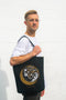 Man holding Sister Moon Baggu Tote