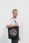 Man holding Friar Minor Baggu Tote