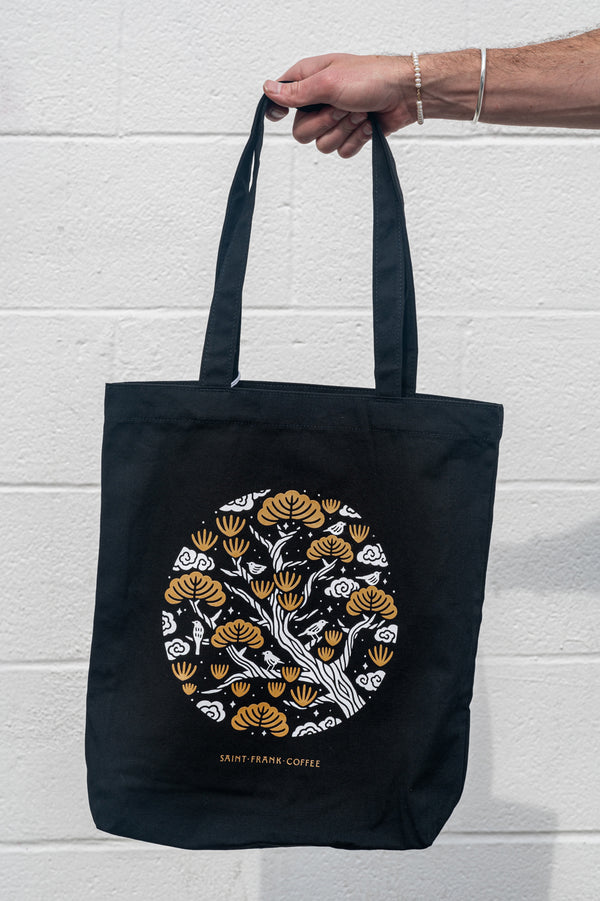 Hand holding Friar Minor Baggu Tote