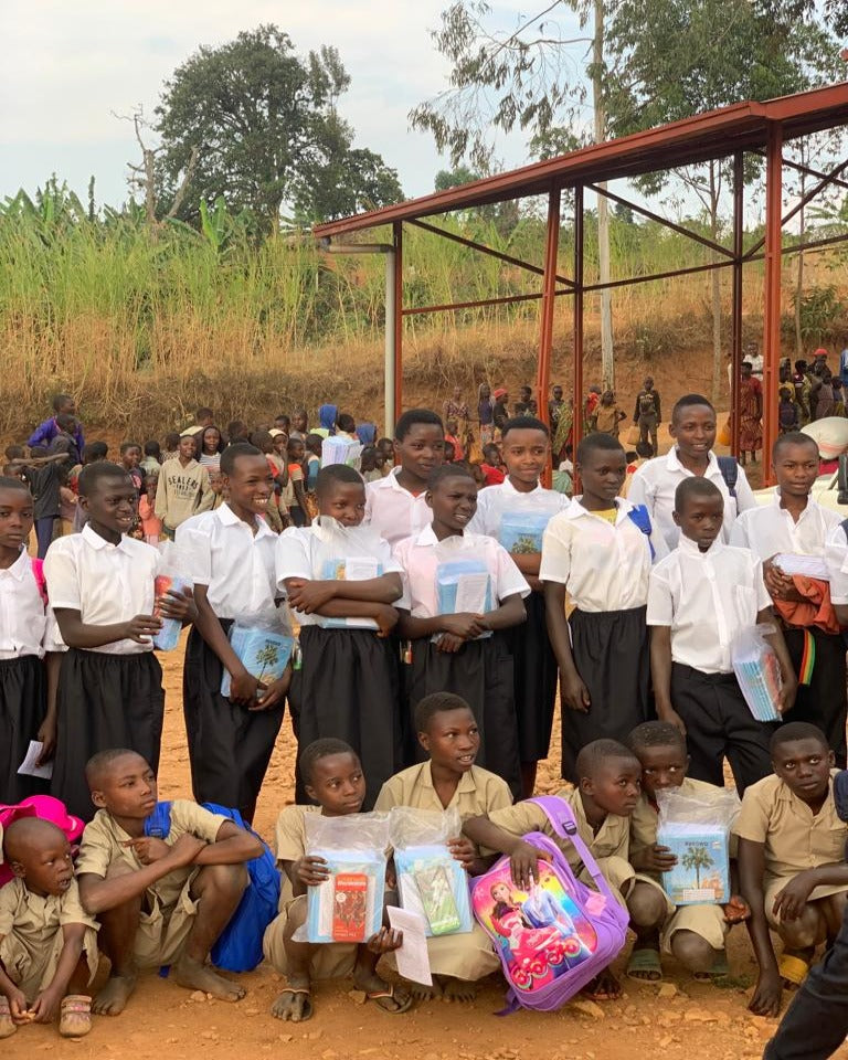 Kids in Burundi holding awards
