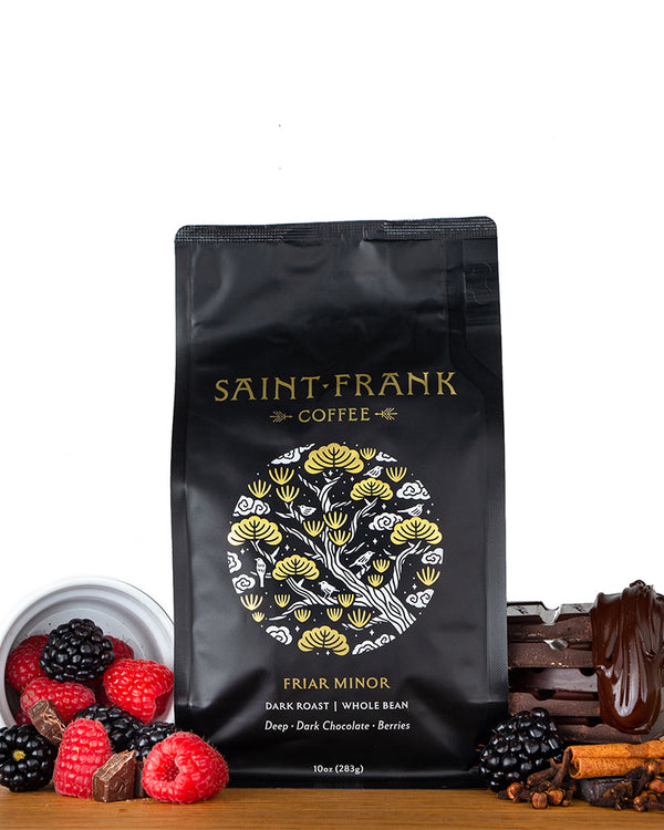 Friar Minor coffee bag surrounded by berries and chocolate
