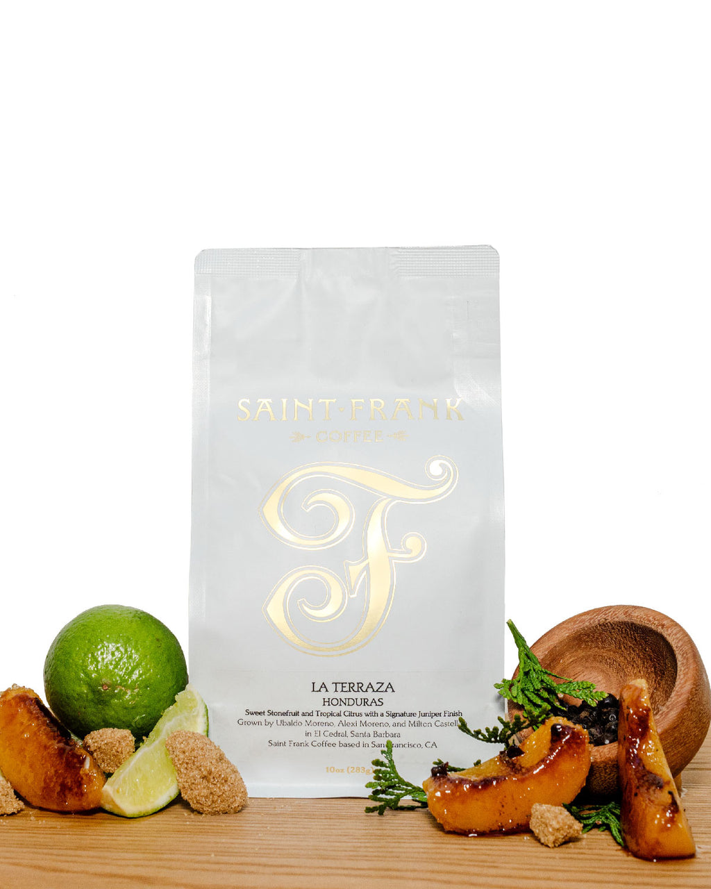 La Terraza coffee bag surrounded by Apricots, Lime, and Juniper